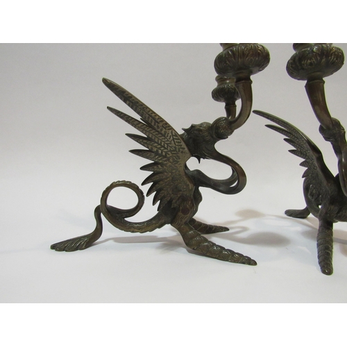 4283 - A pair of Victorian bronze Griffin candlesticks, approximately 18cm high    (R) £80