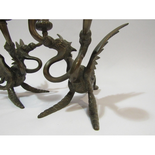 4283 - A pair of Victorian bronze Griffin candlesticks, approximately 18cm high    (R) £80