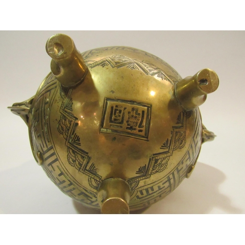 4284 - A 20th Century Oriental brass lidded censor of spherical form with two dragon shaped handles, on thr... 