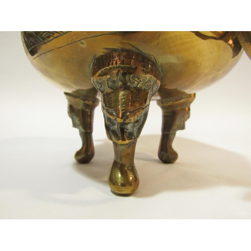 4285 - A Chinese brass censer with cover on tripod mask design feet, twin mask detail to body holding ring ... 