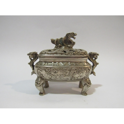 4287 - A Chinese white metal censer and cover having dragon decoration with six character mark to base    (... 