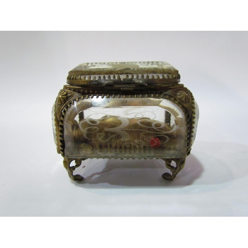 4357 - A bevel edged jewellery casket with etched decorative bird, silk cushion interior, on feet, a/f