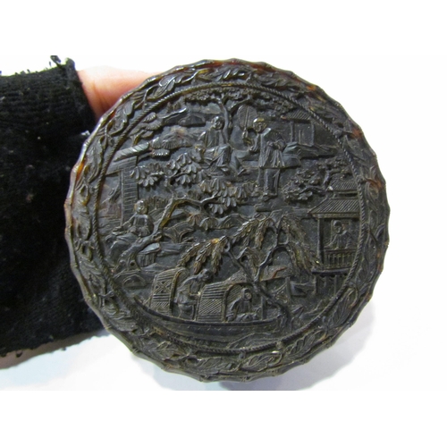 4358 - An Oriental profusely carved in relief tortoiseshell snuff box, A/F, 10cm in diameter