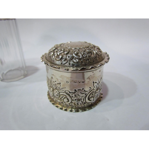 4363 - A silver embossed lidded trinket box, marks rubbed, 5.5cm tall, 6.5cm diameter and three silver lidd... 