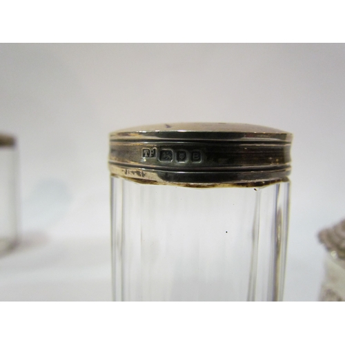 4363 - A silver embossed lidded trinket box, marks rubbed, 5.5cm tall, 6.5cm diameter and three silver lidd... 