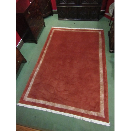 4588 - A peach ground rug with cream and pink patterned borders, 290cm x 200cm