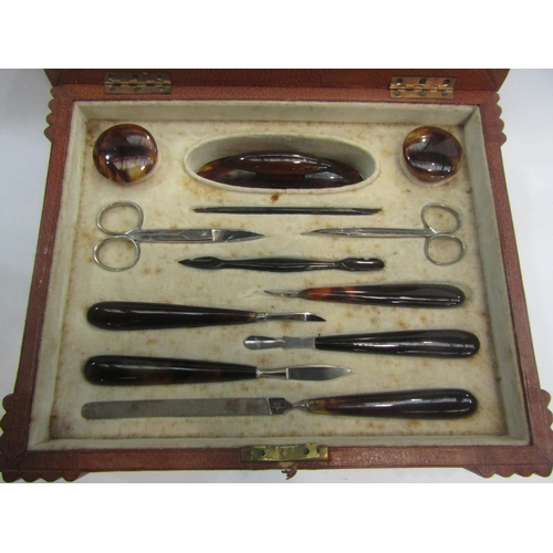 4482 - A leather cased lady's manicure set, lock broken, 9cm x 28cm x 23cm        (E) £20-30