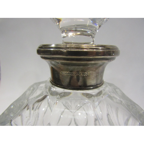 4507 - A cut glass ships decanter with a silver neck and another of square form with silver neck (2)