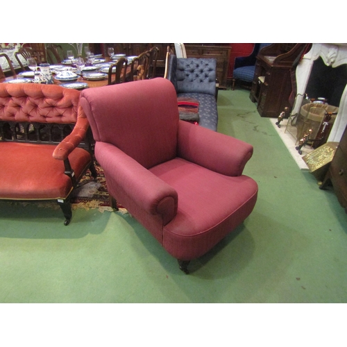 4154 - A circa 1900 country house club armchair in the manner of Howards & Sons of Berners St, the scroll b... 