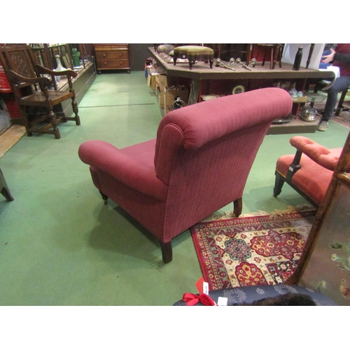 4154 - A circa 1900 country house club armchair in the manner of Howards & Sons of Berners St, the scroll b... 