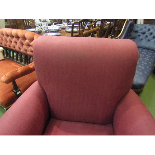 4154 - A circa 1900 country house club armchair in the manner of Howards & Sons of Berners St, the scroll b... 