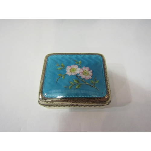 4382 - An Edwardian silver pill / trinket box with guilloche enamel lid decorated with handpainted flowers,... 