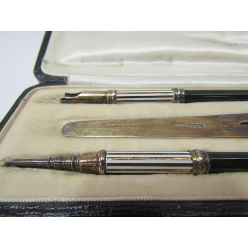 4401 - An early 20thC writing set comprising quill, pencil and letter opener with seal all with jade handle... 