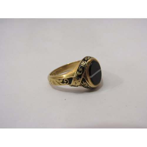 4417 - An 18ct gold memorium ring with oval banded, agate, black enamel decoration with inscription, 6g tot... 