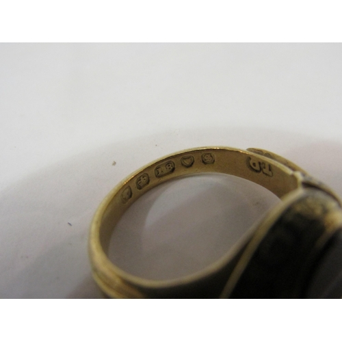 4417 - An 18ct gold memorium ring with oval banded, agate, black enamel decoration with inscription, 6g tot... 