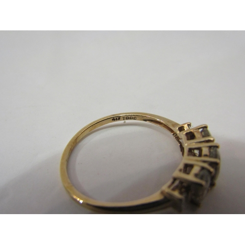 4437 - A 9ct  gold three stone csarite and tapered baguette diamond ring, size S, 2.1g        (E) £70-100