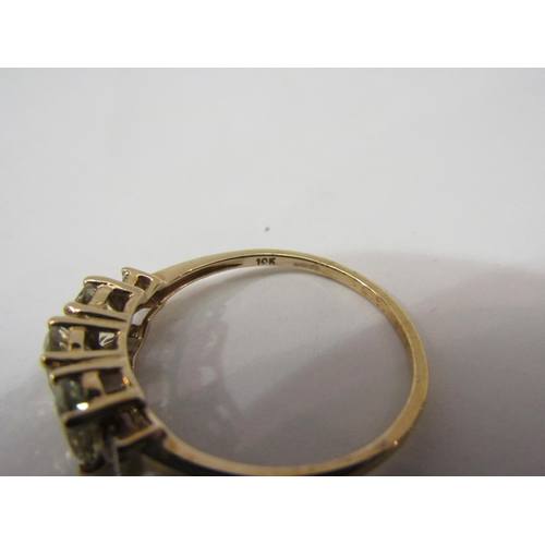 4437 - A 9ct  gold three stone csarite and tapered baguette diamond ring, size S, 2.1g        (E) £70-100