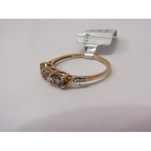 4449 - A 9ct gold csarite and diamond ring, the three csarites flanked by three small diamonds, size m, 1.4... 