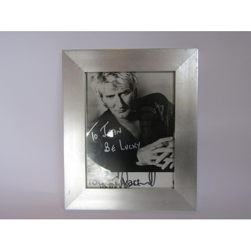 1210 - ROD STEWART: A framed publicity photograph signed and dedicated 