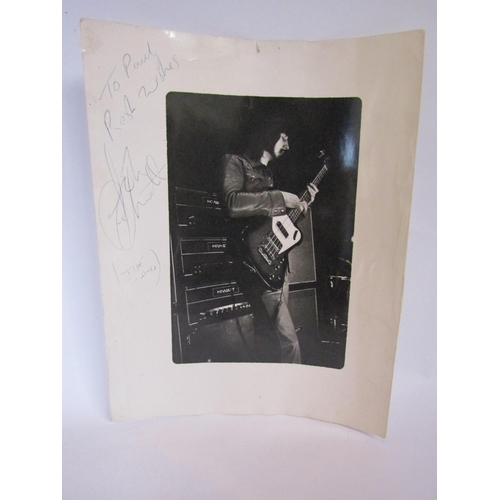 1337 - THE WHO: A black and white photograph on John Entwistle on stage, signed in blue biro 