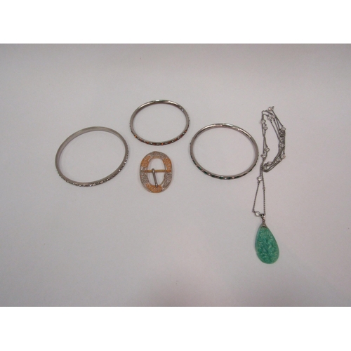 1339 - WITHDRAWN - Three costume paste-set bangles, a yellow metal buckle and a jade effect pendant necklac... 