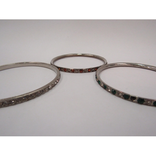 1339 - WITHDRAWN - Three costume paste-set bangles, a yellow metal buckle and a jade effect pendant necklac... 