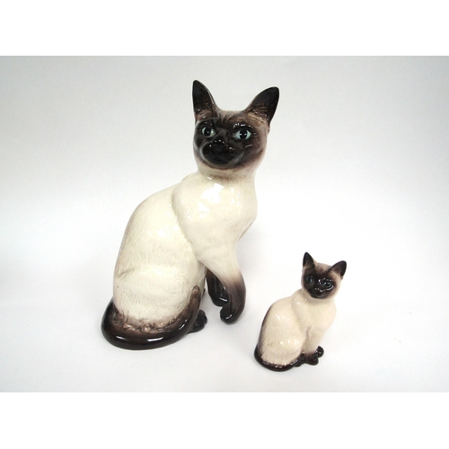 1388 - A Beswick Siamese Cat in seal point gloss, model no. 1882, together with a Beswick Siamese Cat small... 