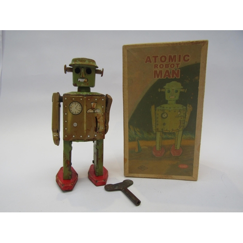 5013 - A boxed reproduction Atomic Robot Man tinplate clockwork robot, water damaged