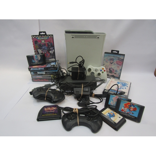 5019 - An unboxed X Box 360 computer games console together with assorted Sega Mega Drive games, controller... 