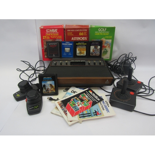 5020 - An Atari video computer game system with two joysticks, two paddles and games to include Asteroids, ... 