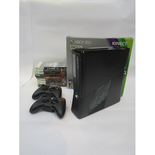 5026 - A boxed X-Box 360 computer games console together with nine boxed games to include Alan Wake, Assass... 