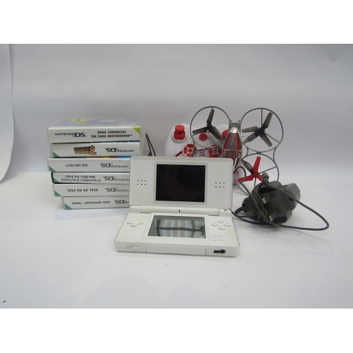 5028 - A Nintendo DS with games and a Syma RC gyrocopter