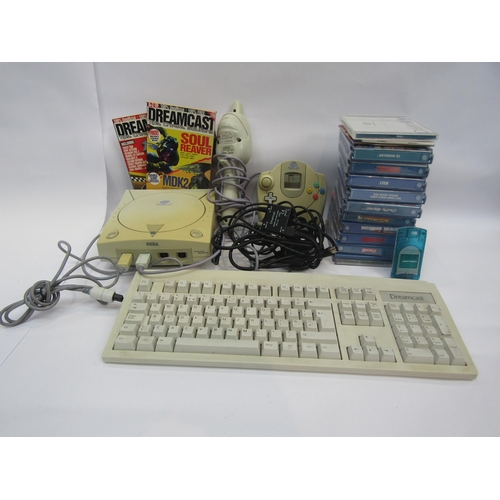 5030 - A Sega Dreamcast computer games console with controller, keyboard, memory card and ten games to incl... 