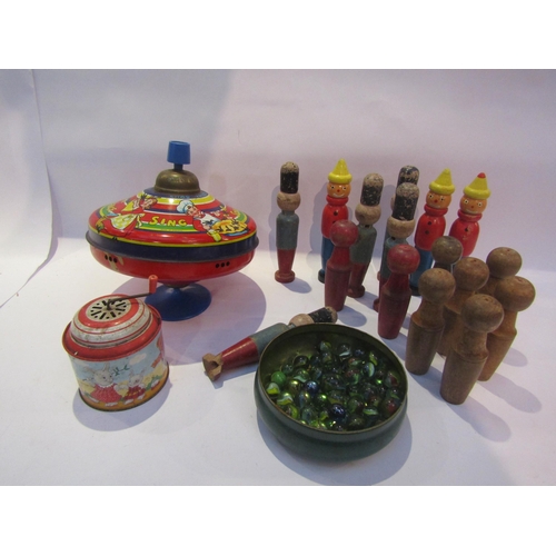 5061 - A tinplate spinning top and music box, vintage wooden skittles and a tin of modern marbles