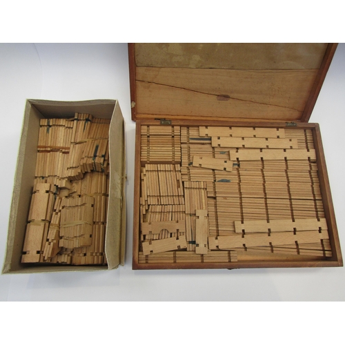 5088 - An early 20th Century wooden boxed set of interlocking Building Blocks together with a box of additi... 