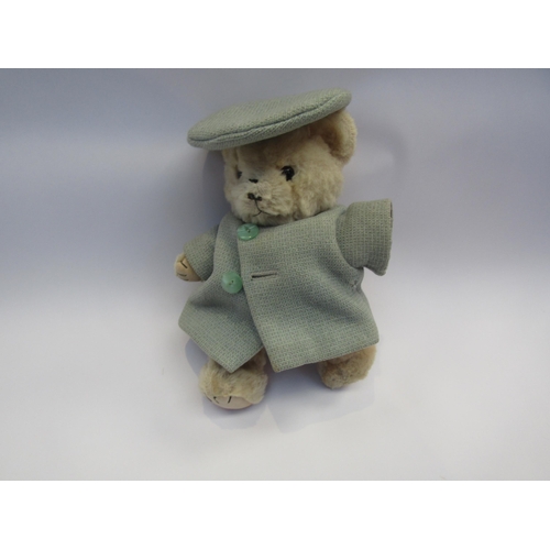 5091A - A small jointed teddy bear in pale blue coat and hat