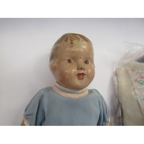 5103 - A vintage cloth bodied doll with painted composition head, assorted dolls outfits, costume dolls and... 