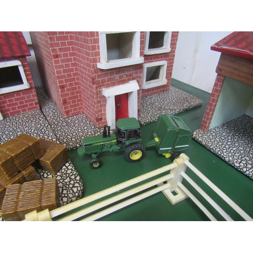 5120 - A wooden model farm with a collection of plastic figures and accessories including Britains