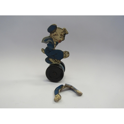 5122 - A Chad Valley pull along dog, the printed card dog in a sailors outfit, on wooden stand with Bakelit... 