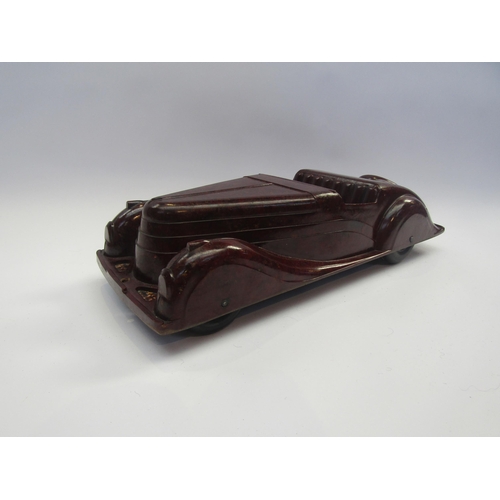 5123 - A Codeg mottled brown bakelite open topped tourer car, 34.5cm long        (R) £80