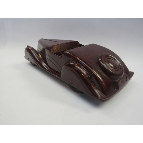 5123 - A Codeg mottled brown bakelite open topped tourer car, 34.5cm long        (R) £80