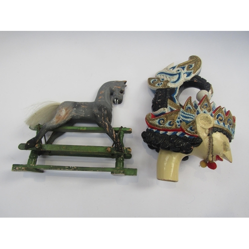 5125 - A miniature carved wooden rocking horse on trestle base, 15.5cm tall x 18cm long, together with an I... 