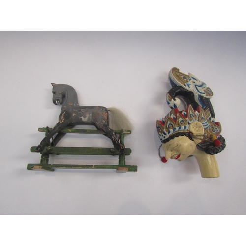 5125 - A miniature carved wooden rocking horse on trestle base, 15.5cm tall x 18cm long, together with an I... 