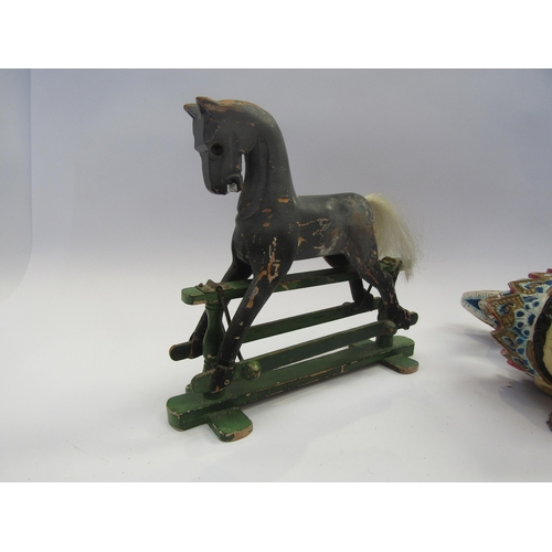 5125 - A miniature carved wooden rocking horse on trestle base, 15.5cm tall x 18cm long, together with an I... 