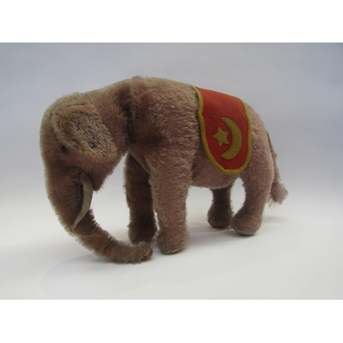 5127 - A Steiff pink mohair rotating head elephant, black glass eyes with felt discs behind, white felt tus... 