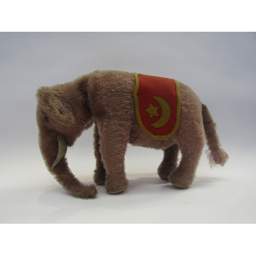 5127 - A Steiff pink mohair rotating head elephant, black glass eyes with felt discs behind, white felt tus... 