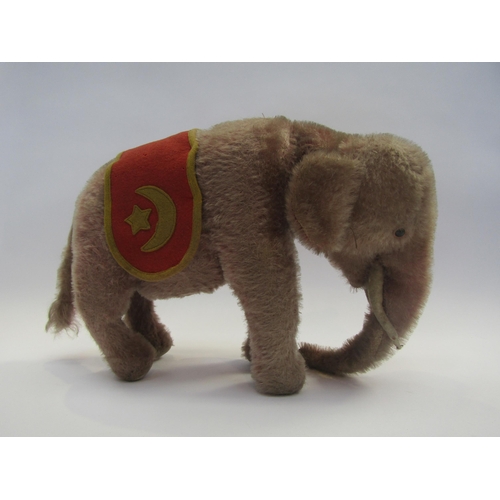 5127 - A Steiff pink mohair rotating head elephant, black glass eyes with felt discs behind, white felt tus... 