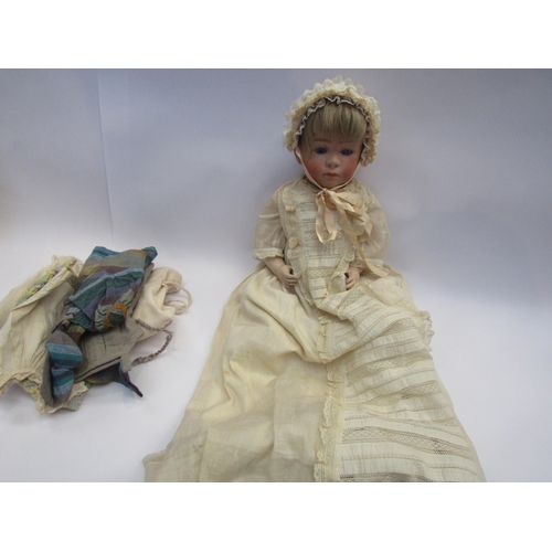 5131 - A German bisque head doll on jointed composition body, head heavily restored, 45cm tall