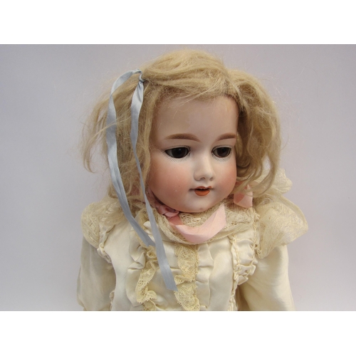 5132 - An Armand Marseille bisque head doll on jointed composition body, sleepy brown eyes and open mouth s... 