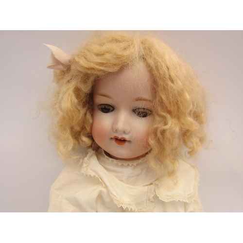 5135 - An Armand Marseille bisque head doll with brown sleepy eyes, open mouth showing four teeth, blonde w... 